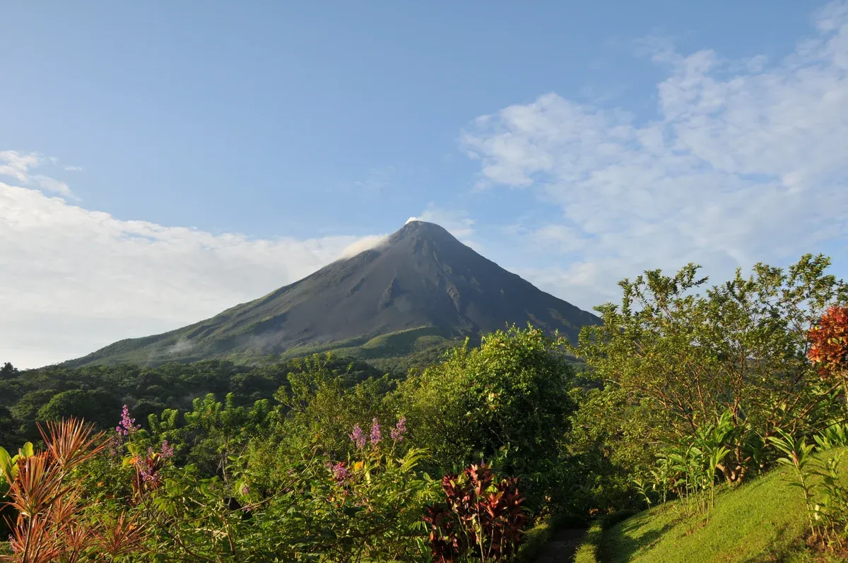 Arenal Volcano seen from the hillside gardens near the hot springs of La Fortuna, Costa Rica